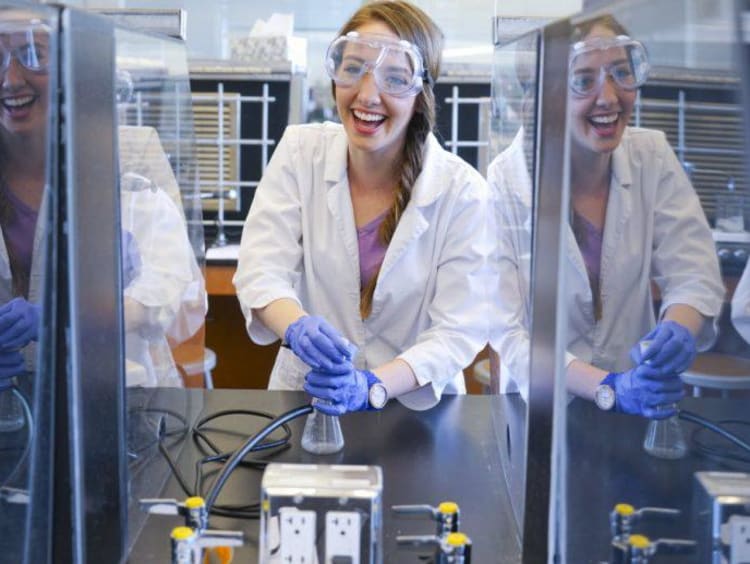 chemistry student working on a project in a lab