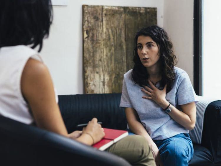 Woman talking to another woman