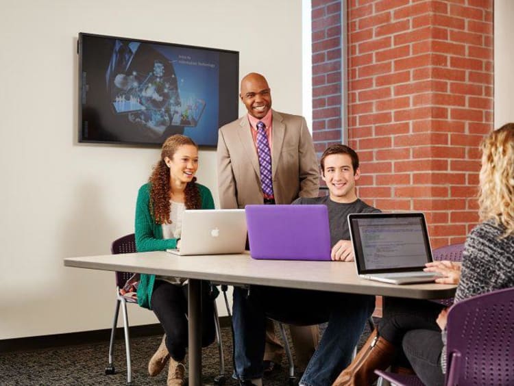 GCU students with their professor in a GCU classroom