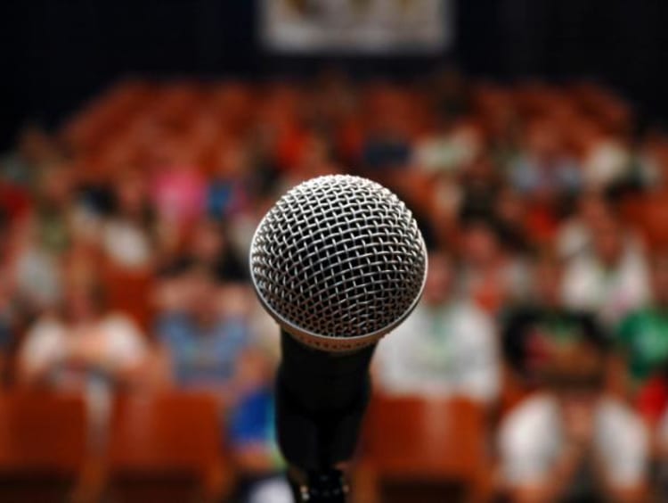 Microphone in front of a crowd