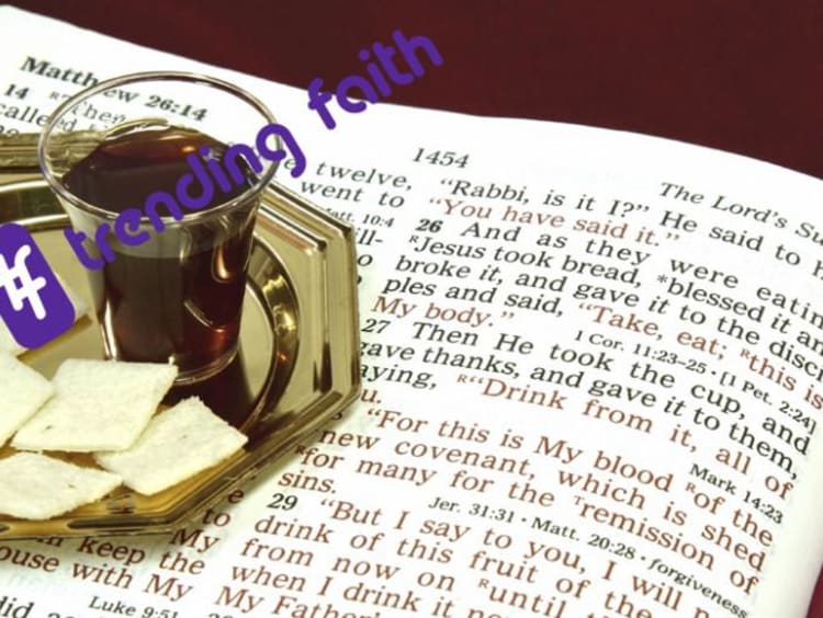 Communion wafers and wine sitting on the Bible with the Trending Faith logo