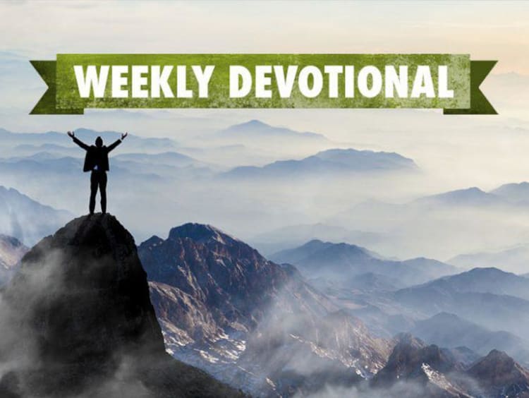 man standing on top of a hill with weekly devotional banner above