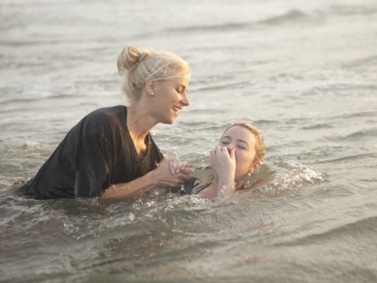 person getting baptised