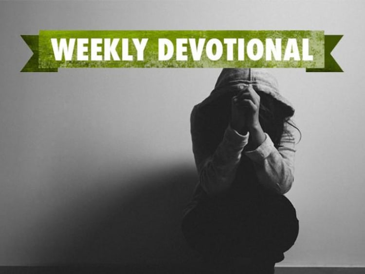 Grayscale image of hooded female in crouched praying position with weekly devotional text