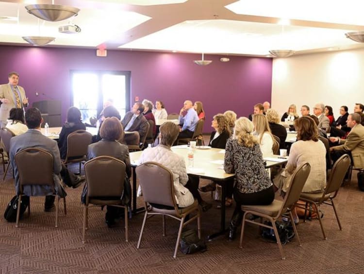 Students learning around a table