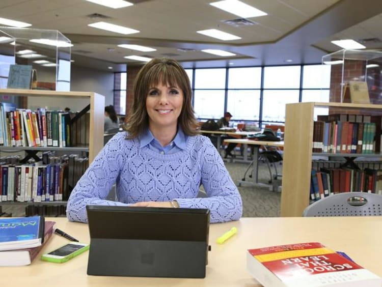 Cathy Ames in a library