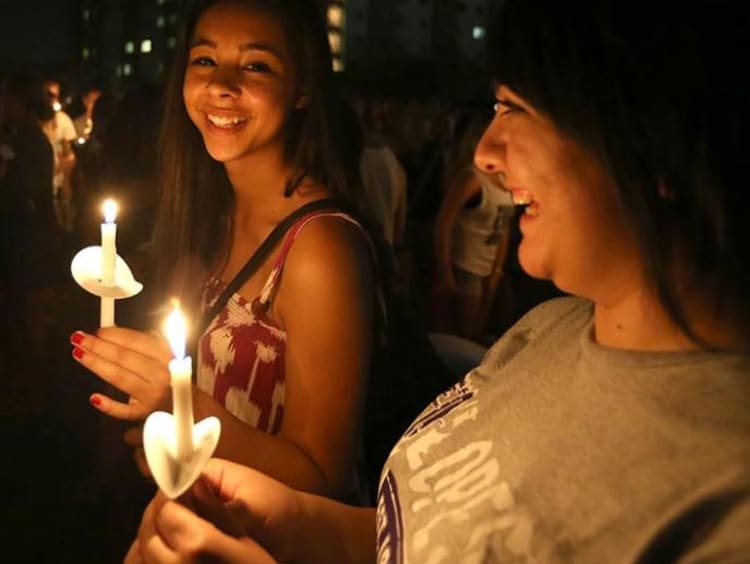 Two girls with candles in hand