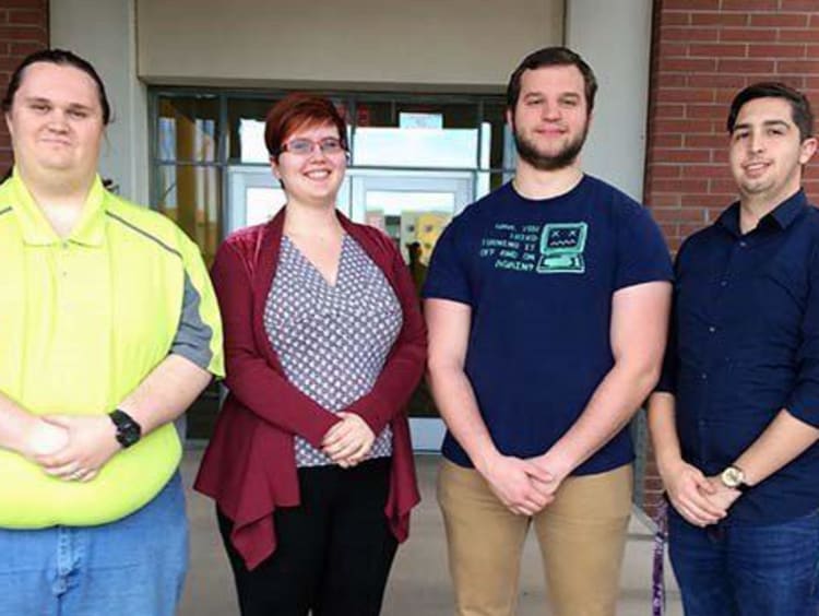 Four IT grads at GCU