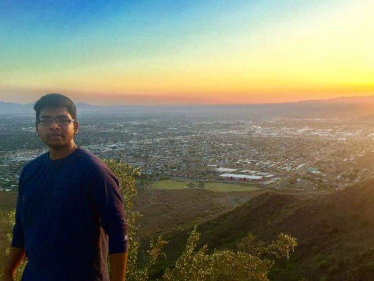 person standing on mountain