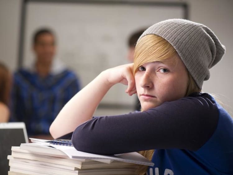 A college student looking tired and unhappy