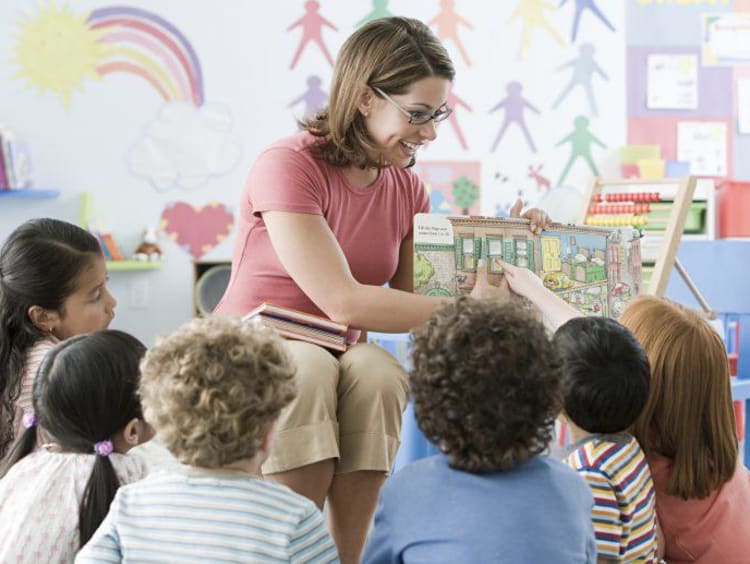 Teacher has interactive reading circle time