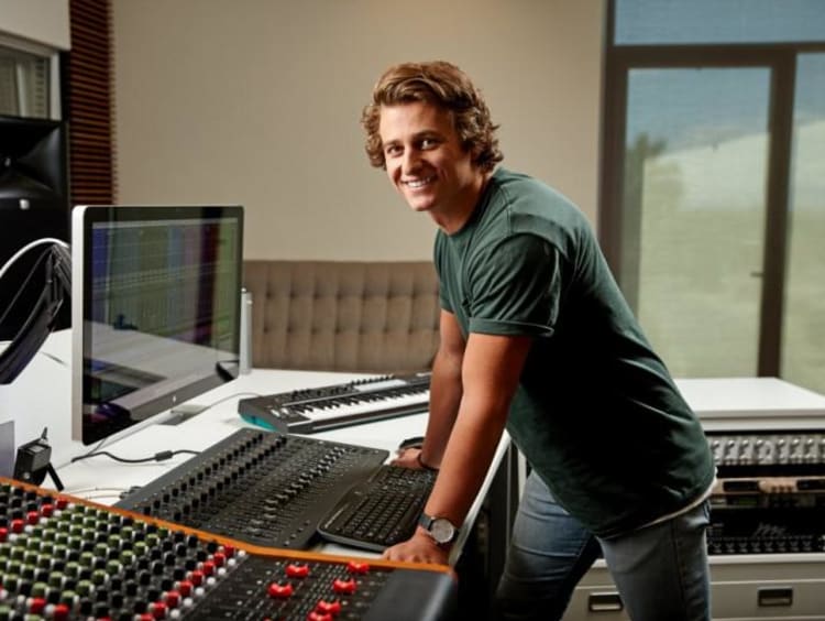 A student working at a soundboard