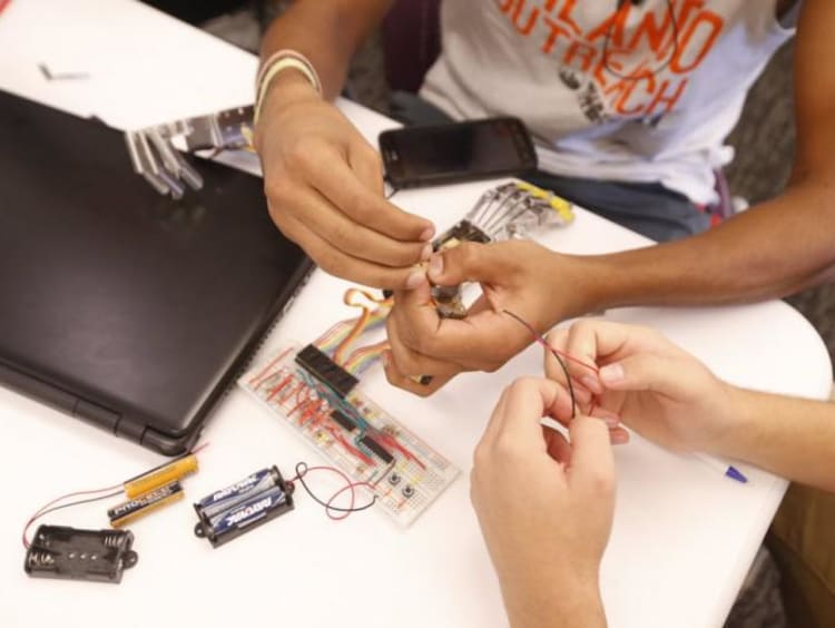 hands working with wires