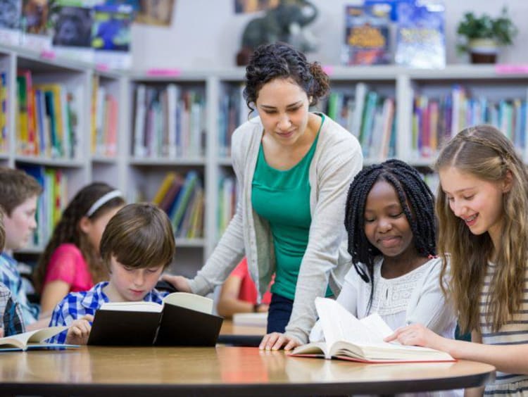 A teacher reading to her students