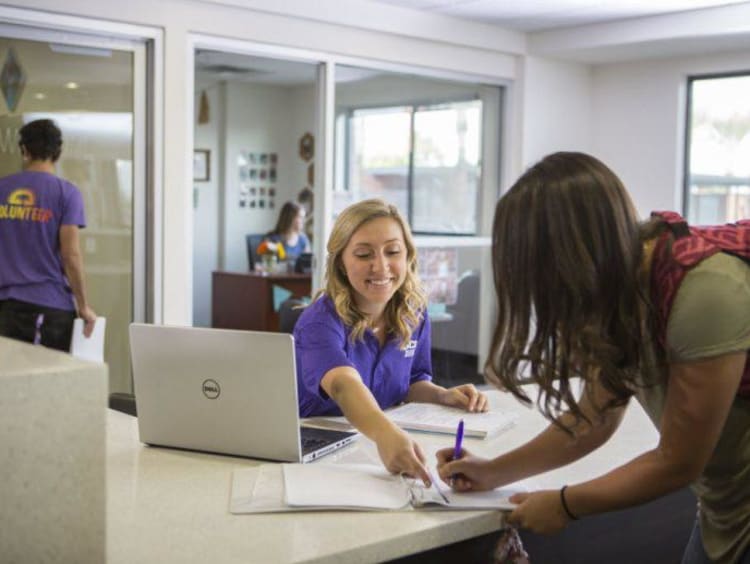 College students consulting about funds