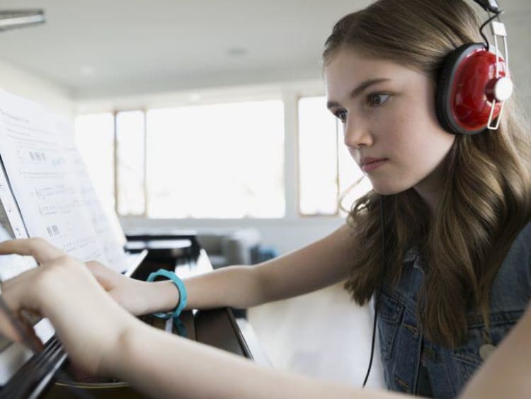 Piano student using a tablet