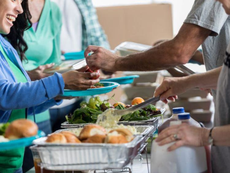 A soup kitchen serving people food