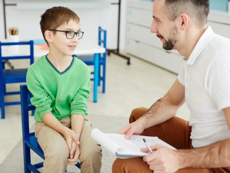 a special education teacher working with a student