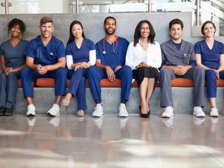 Nurses sitting together on a bench