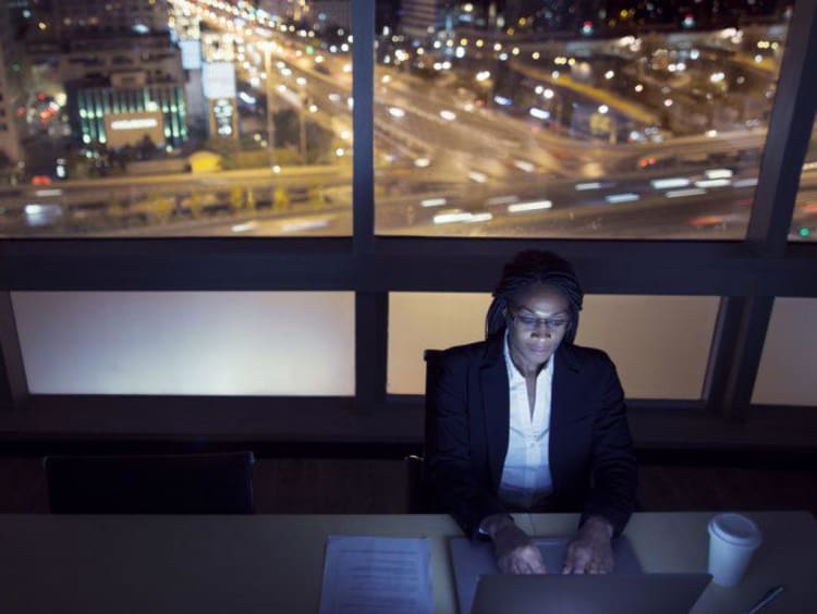 woman on a computer at night