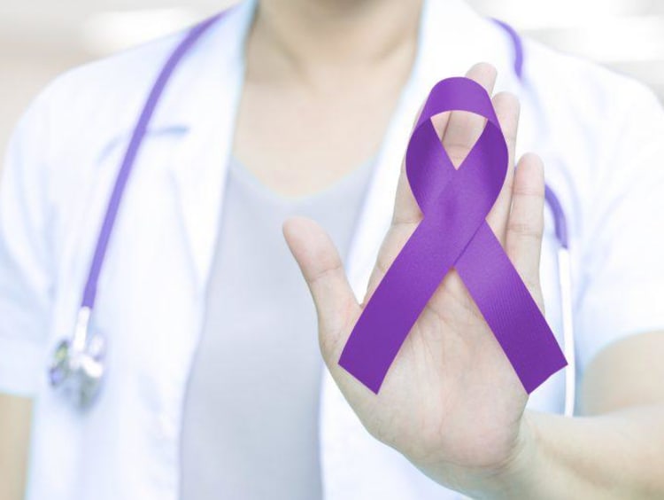 Nurse with a purple Alzheimer's ribbon