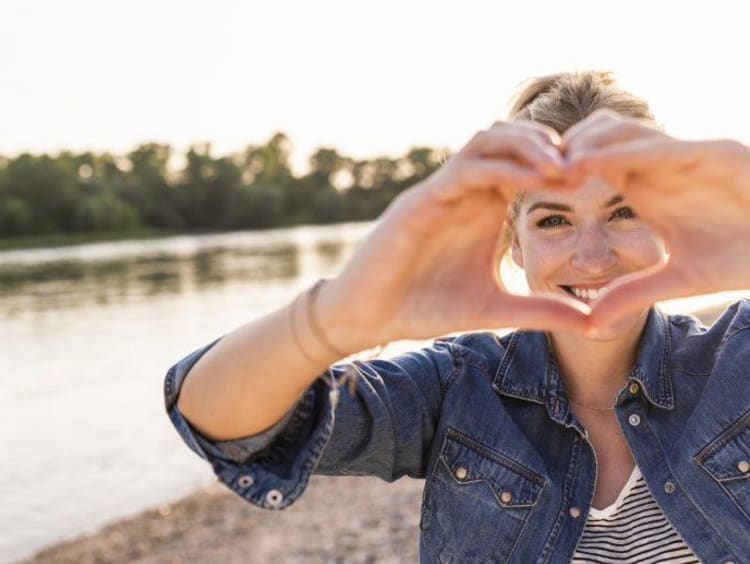 Woman making her hands a heart shape