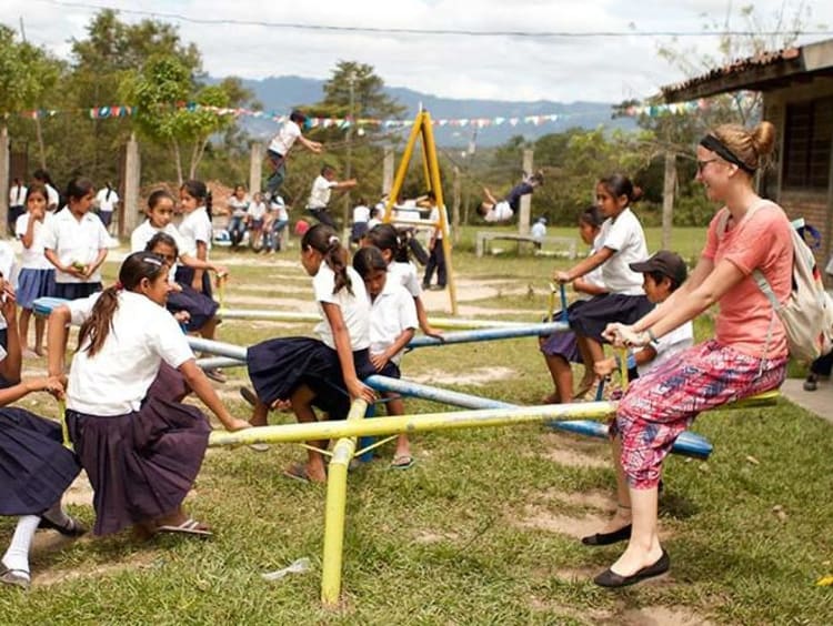 Children play outside in schoolyard setting