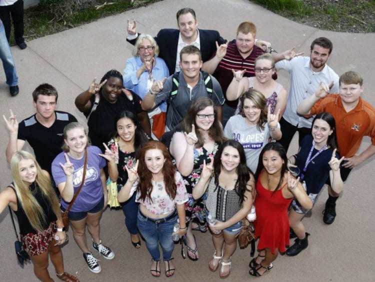 students throwing the Lopes up