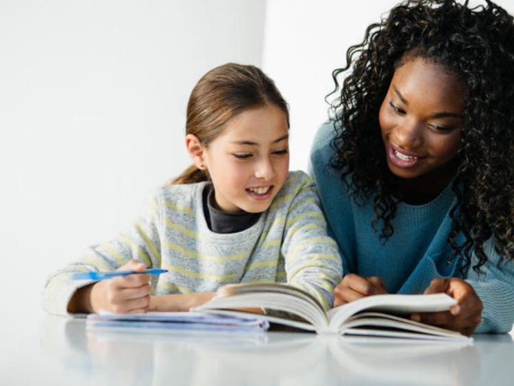 teacher helping student