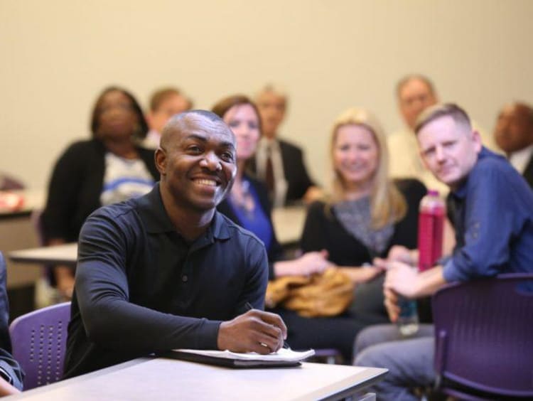 Adult students at college of doctoral studies orientation