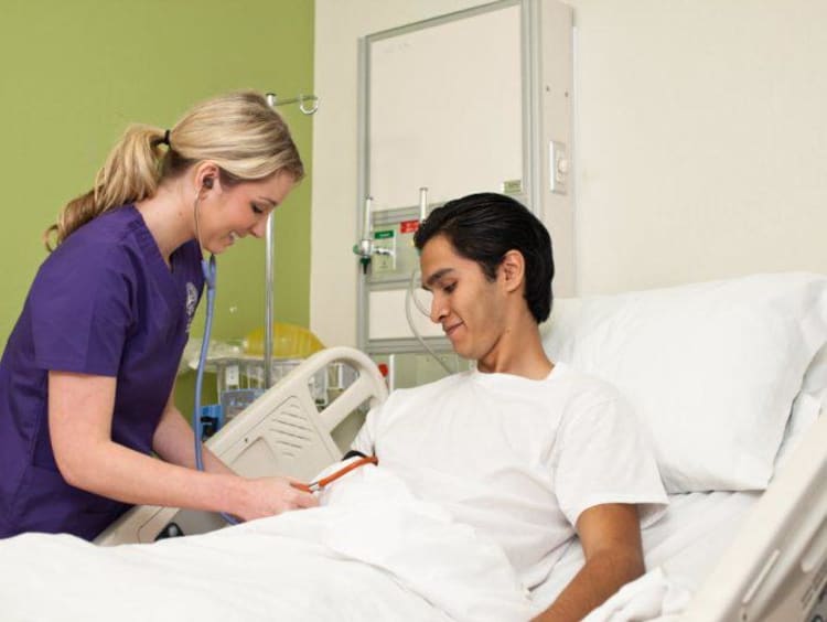 Nurse helping patient 