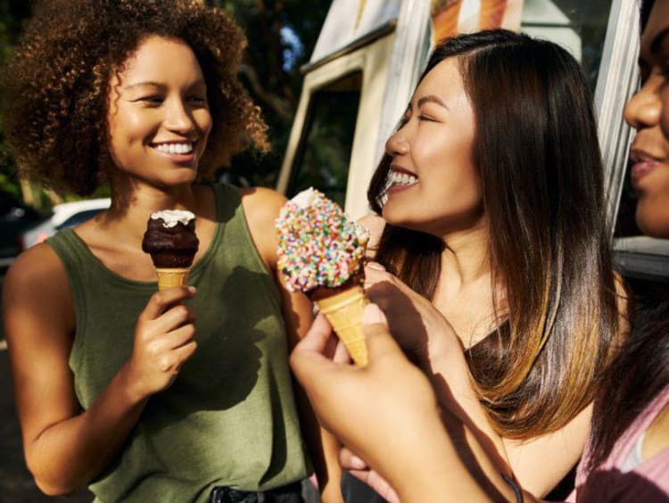 three girls eating ice cream