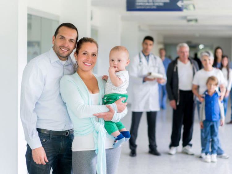 hospital patients with nurses and doctors behind them