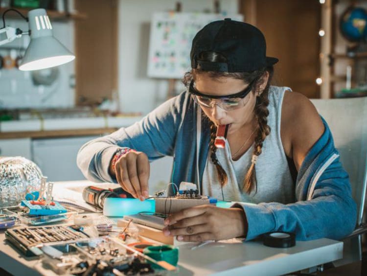 A STEM student working at her desk