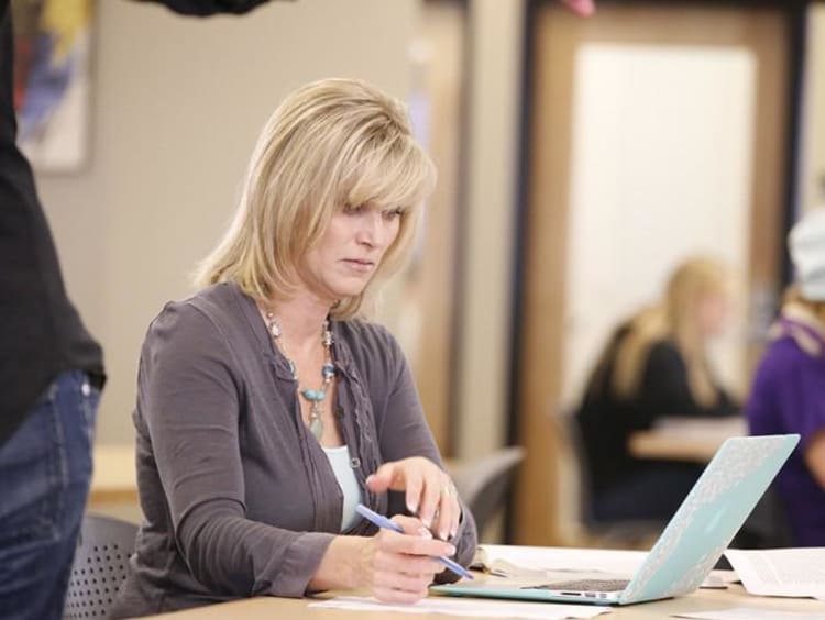 woman writing her dissertation