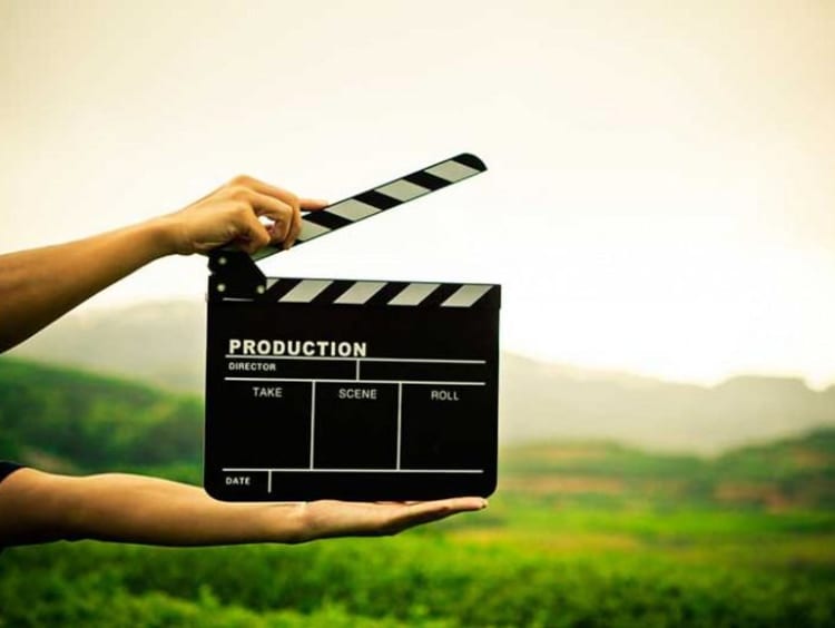 person holding clapperboard