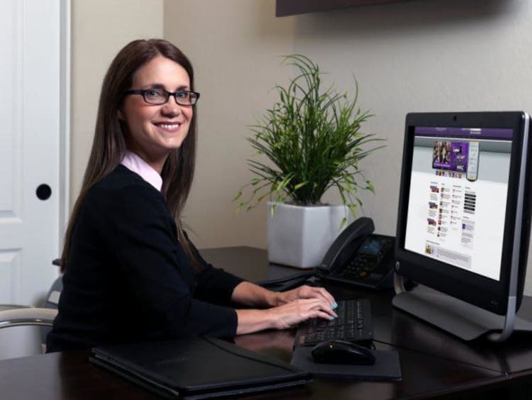 Female doctoral student browses the GCU website