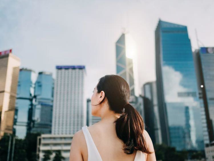 Girl looking at skyscrapers