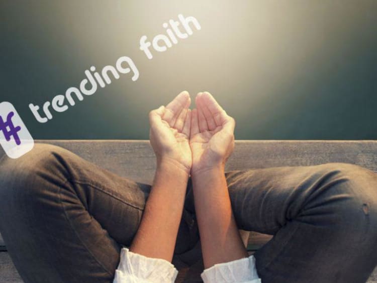 A pair of open hands under the Trending Faith logo