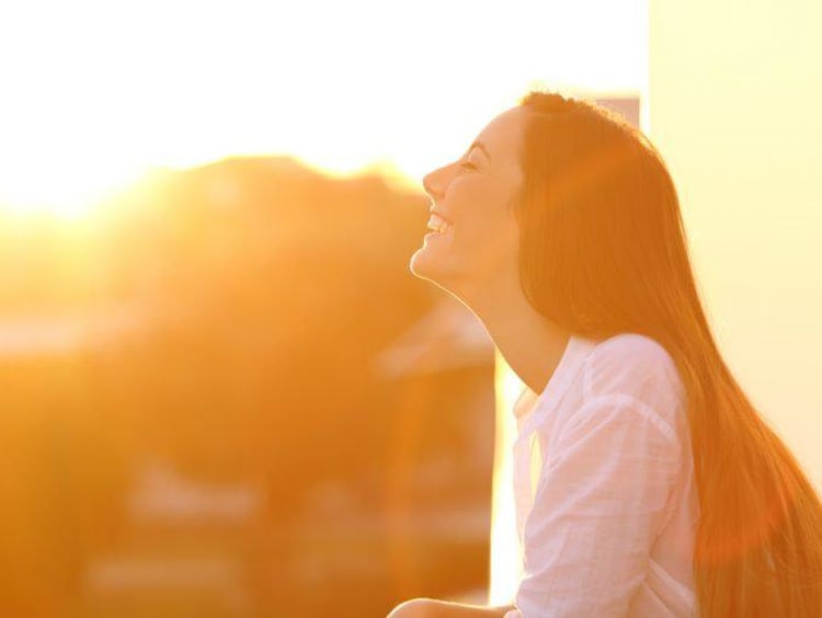 woman smiling in sunlight