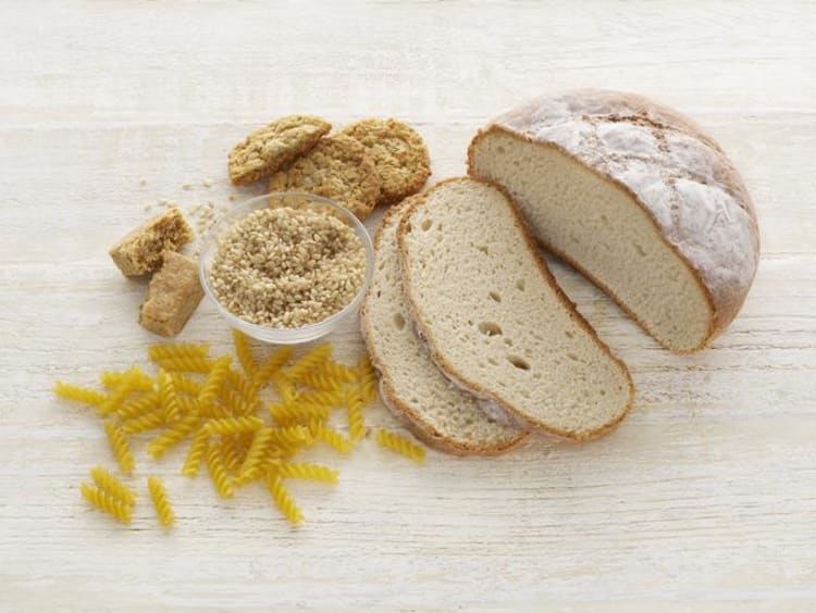 Bread and pasta on a wooden surface