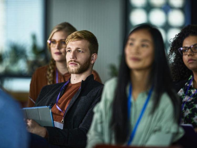 Attentive audience seated during a presentation