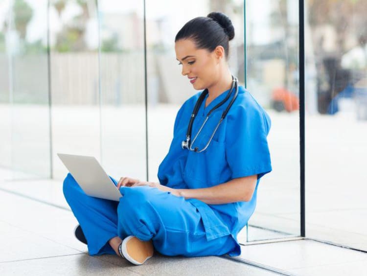 nurse using her laptop