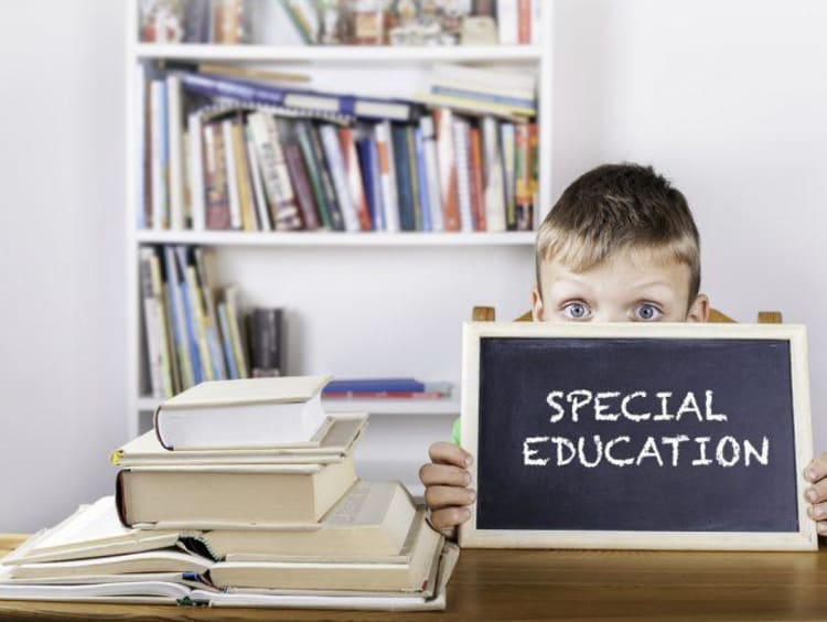 little boy with chalkboard