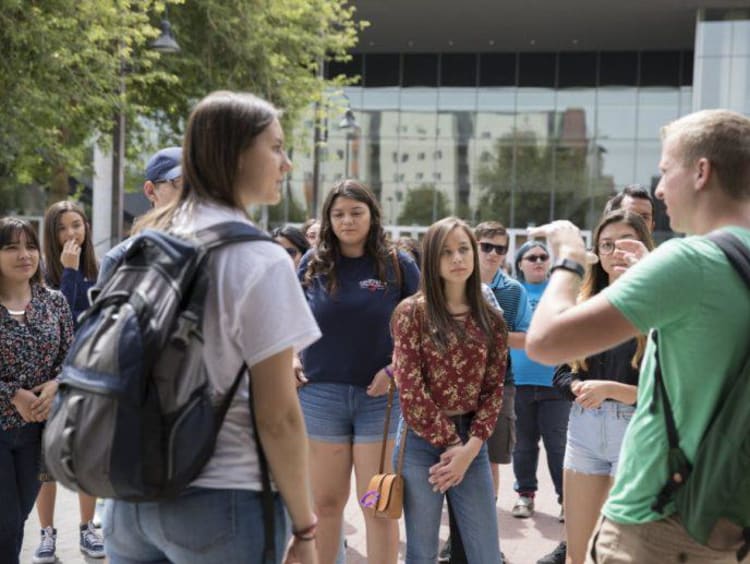 A group of students touring campus