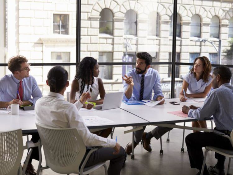 Students around table with big windows