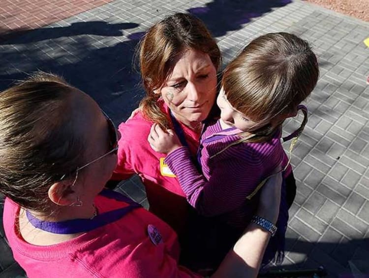 Two females with a little child