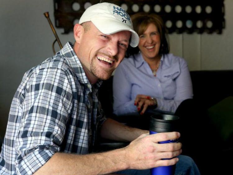 A military vet smiling in his house