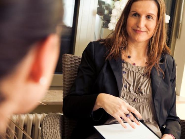 Woman talking to another female