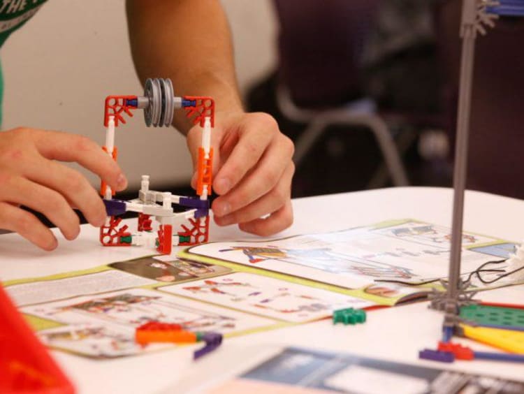 stem student building a prototype